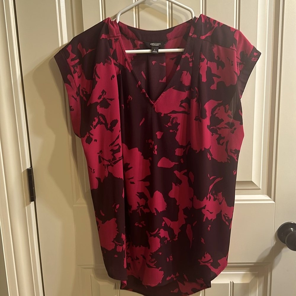 Worn once. Colorful blouse.